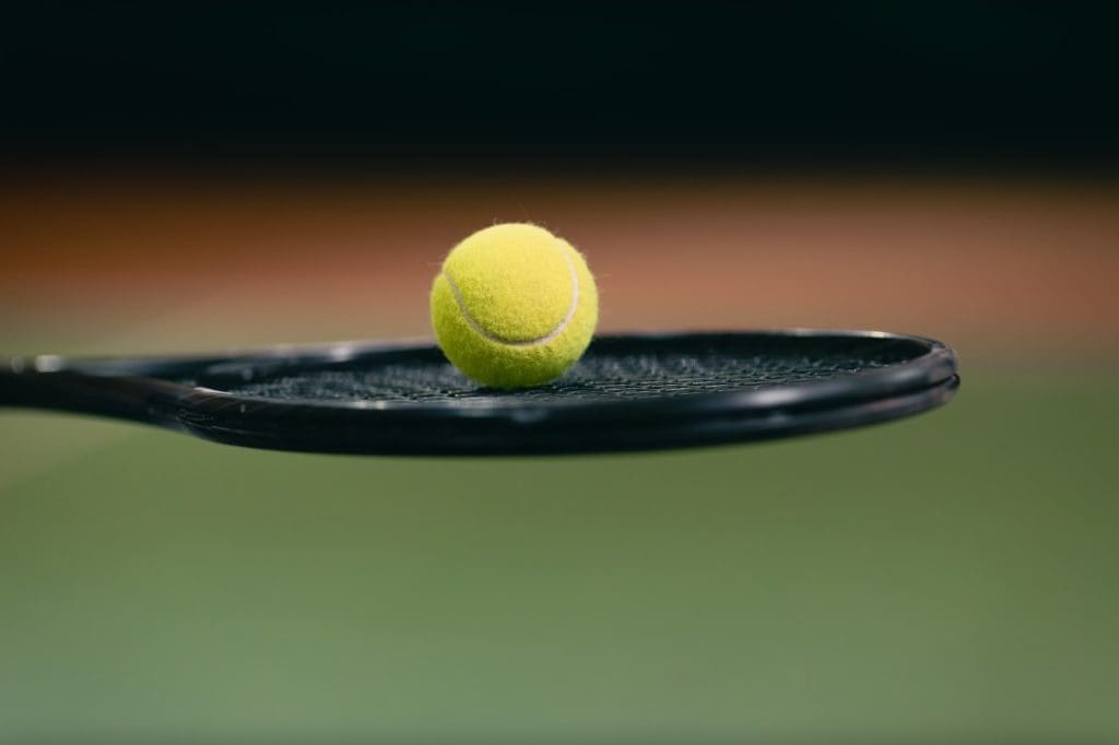 tennis hold ball on racket ball racket