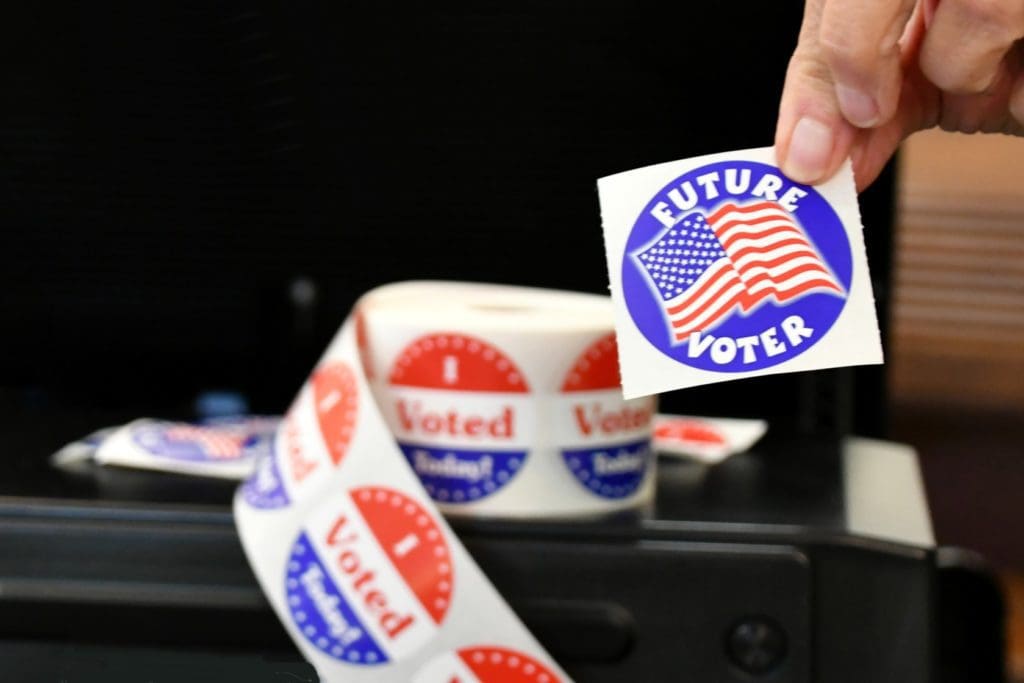 A sticker that says Future Voter over the American flag