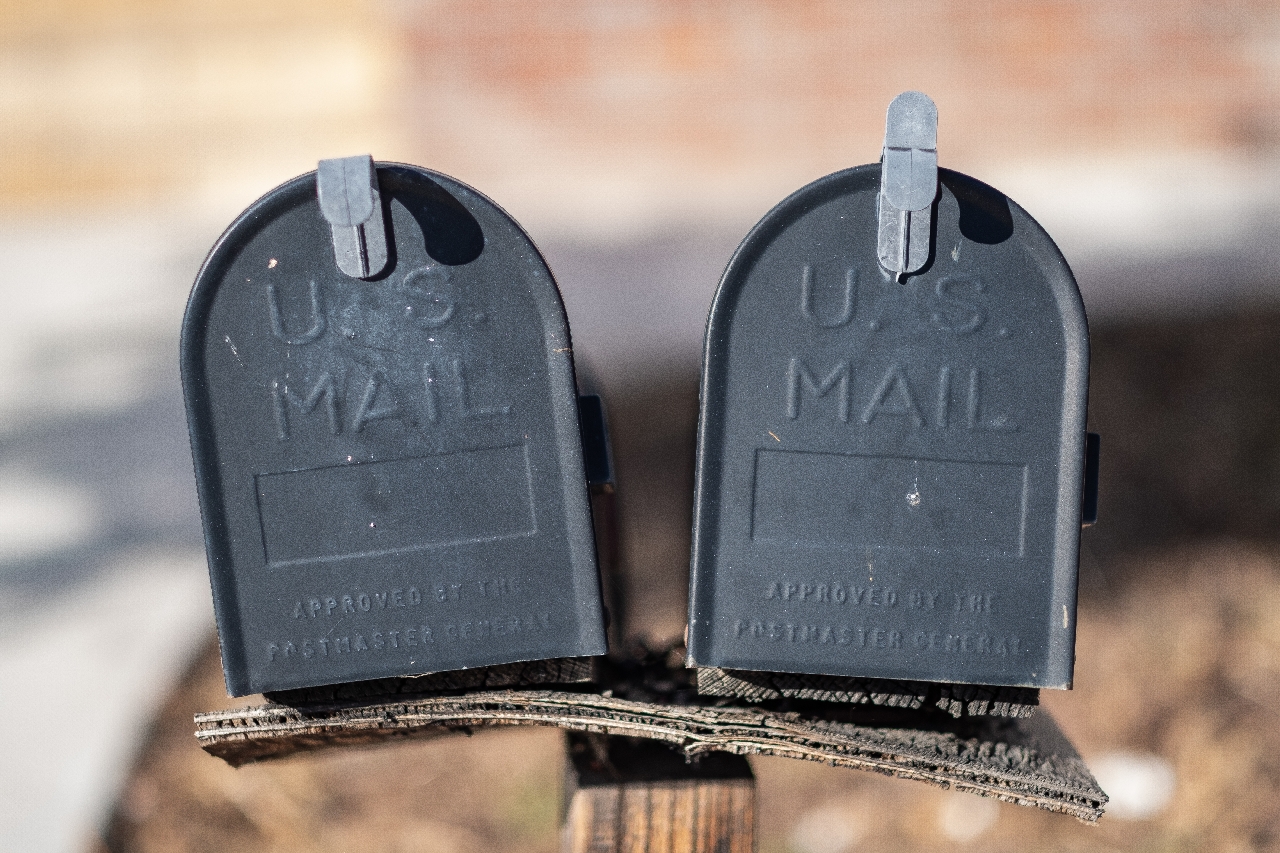 two black mailboxes