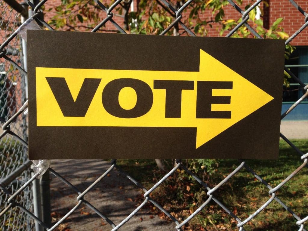 A sign that says Vote