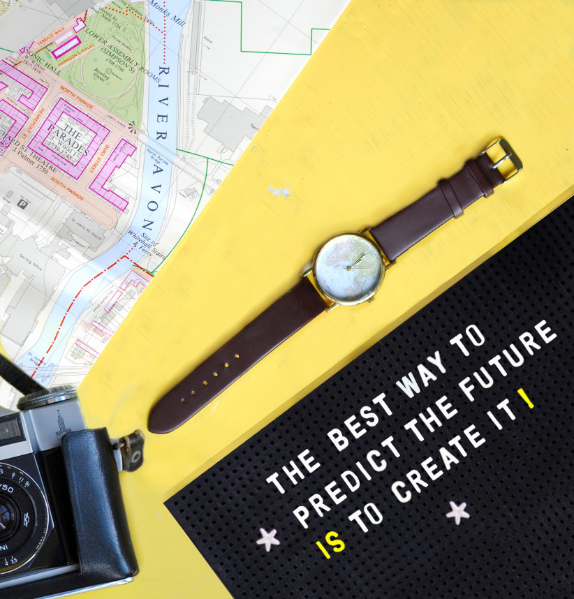 flat-lay-with-watch-camera-and-map-inspirational-quote-on-pegboard-yellow-background_t20_1J0Gmg