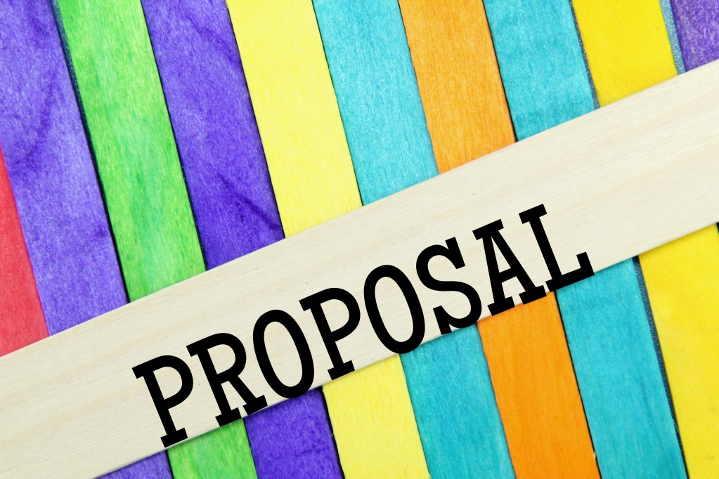 a multicolored background with the word "proposal" in front